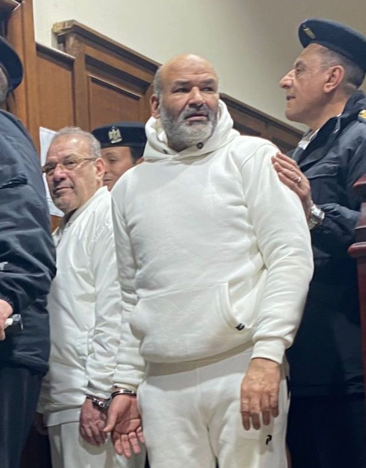 ترحيل حسن راتب وعلاء حسانين لسجن 15 مايو بعد الحكم عليهما بقضية